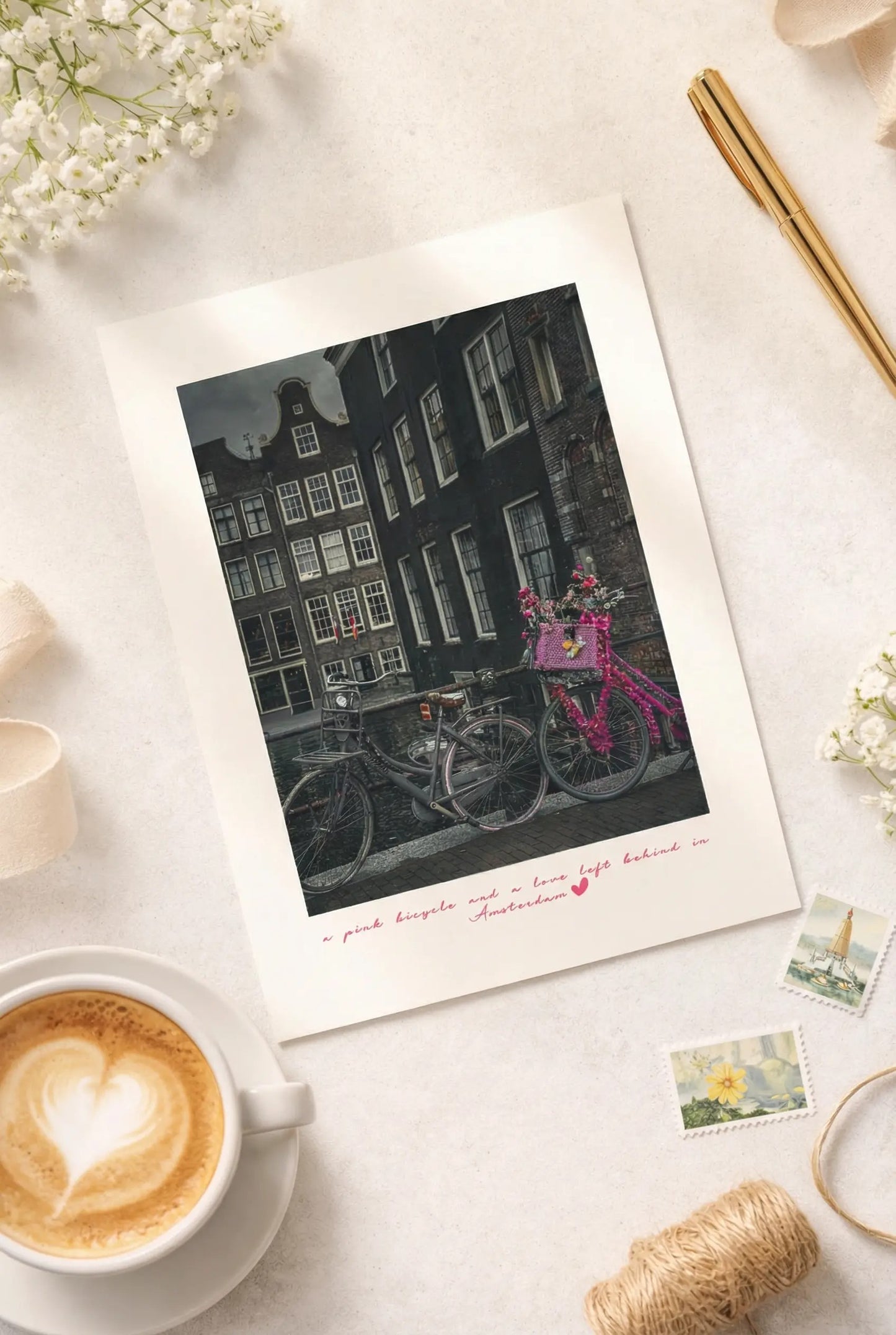 Pink Bicycle in Amsterdam postcard styled with stationery and travel inspired details.