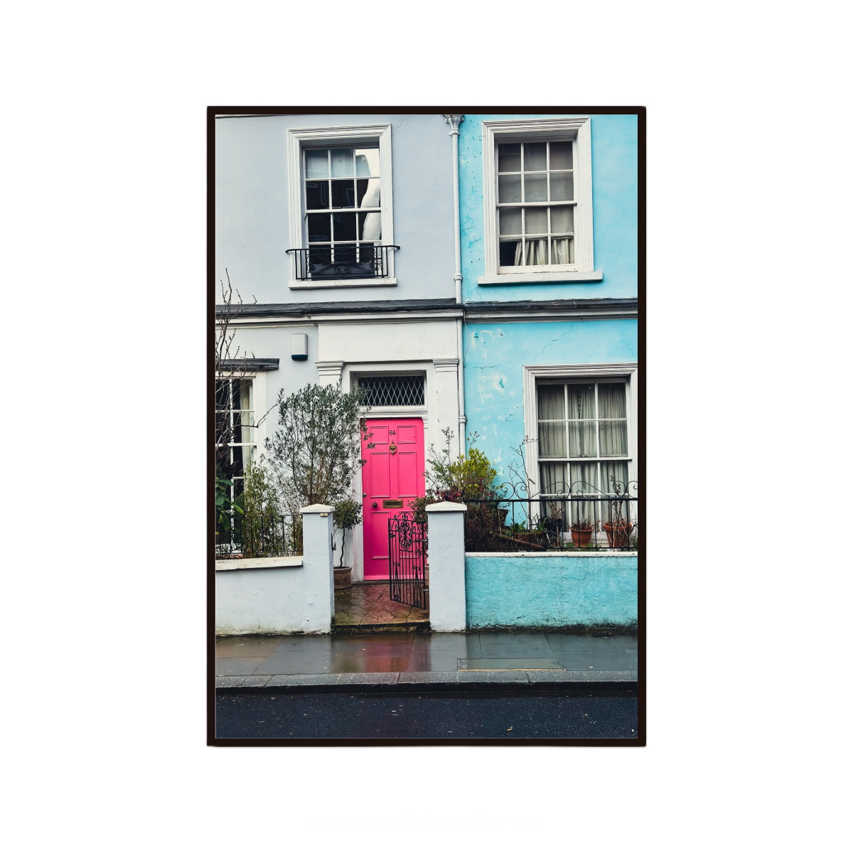 Colourful wall art featuring a bright pink door and pastel houses in London.