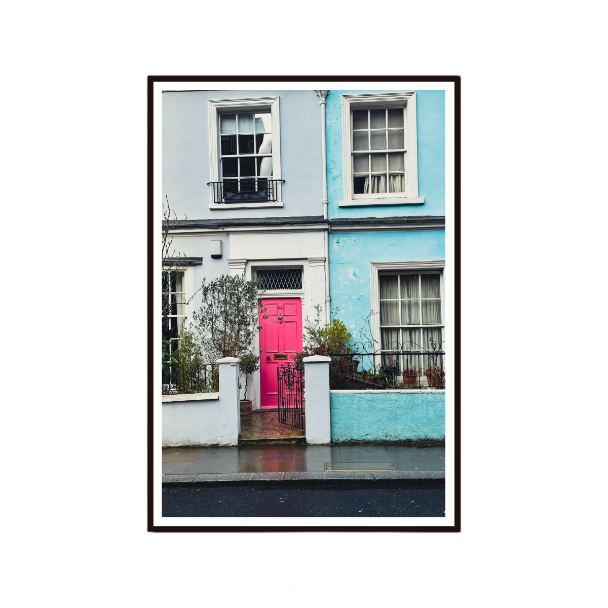 Colourful wall art featuring a bright pink door and pastel houses in London.