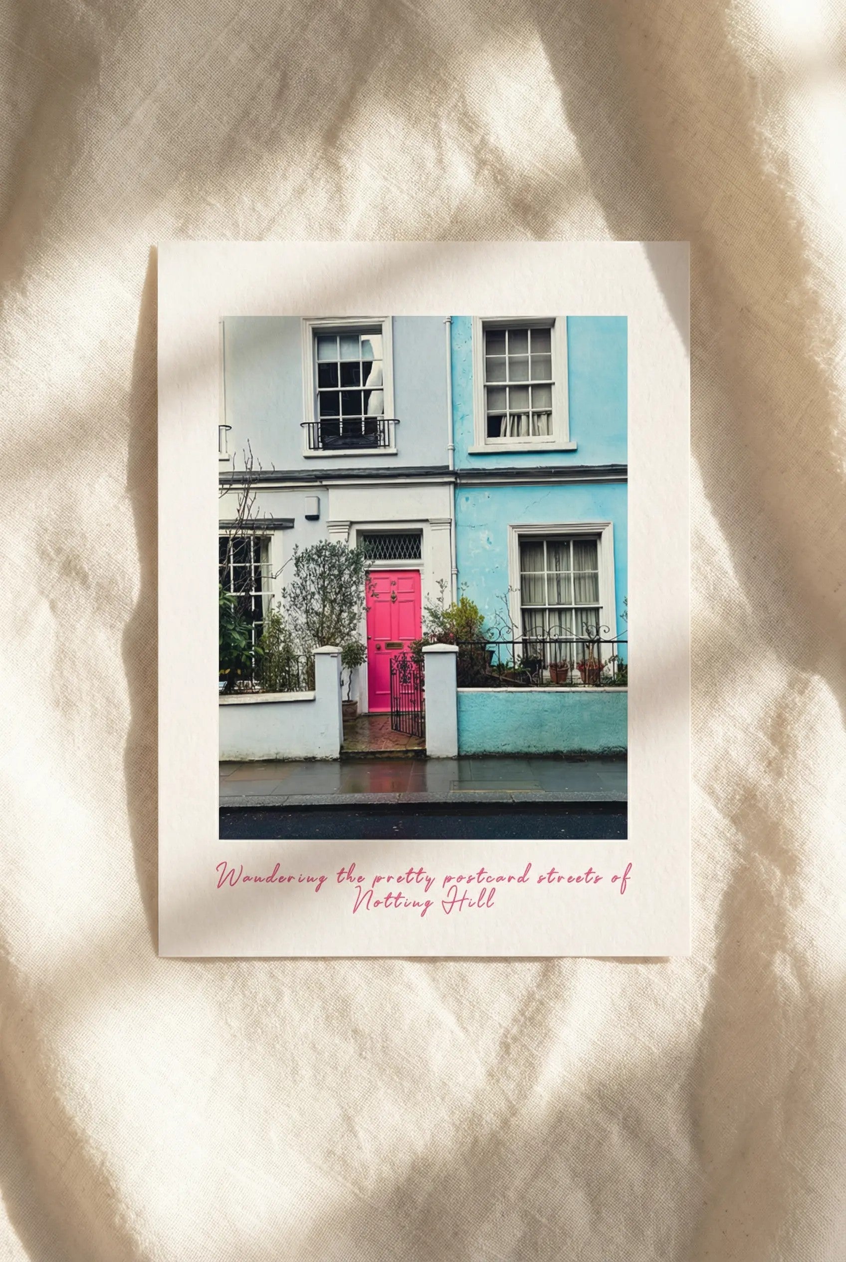 London postcard featuring colourful houses and streets in Notting Hill on beige linens.