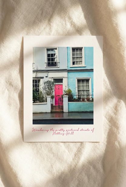 London postcard featuring colourful houses and streets in Notting Hill on beige linens.